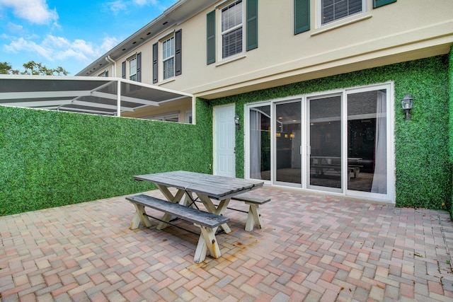 view of patio / terrace with a lanai