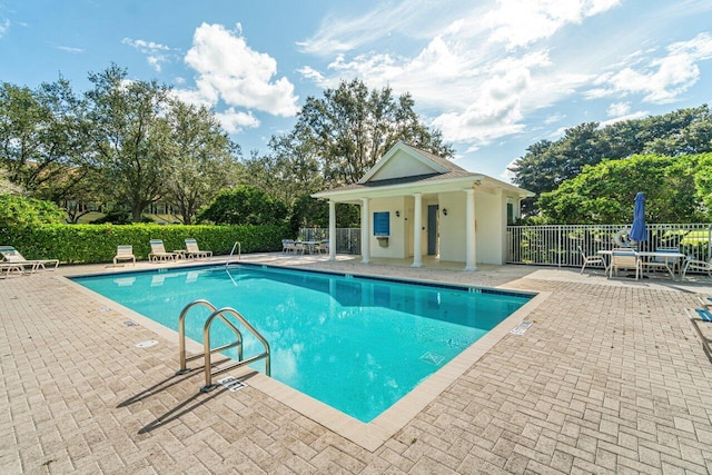 view of swimming pool featuring a patio area