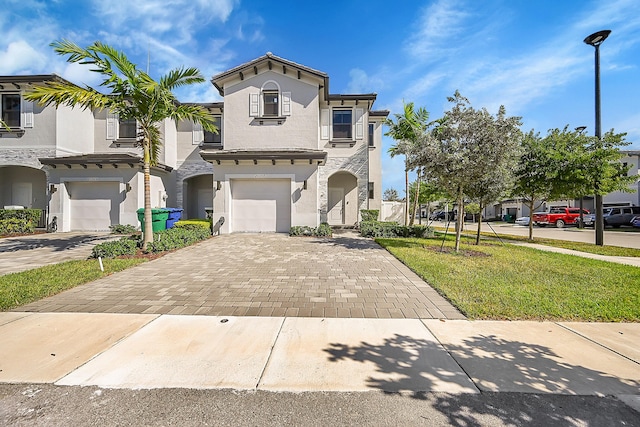 20357 NW 4th Path, Miami Gardens, FL 33169 - view of front of home with an attached garage, decorative driveway, stucco siding, a front lawn, and stone siding