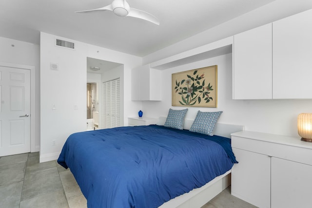 bedroom featuring ceiling fan and ensuite bath