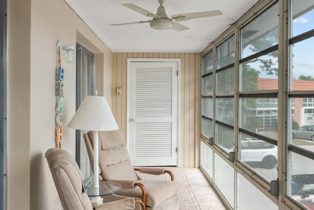 sunroom with a wealth of natural light and ceiling fan