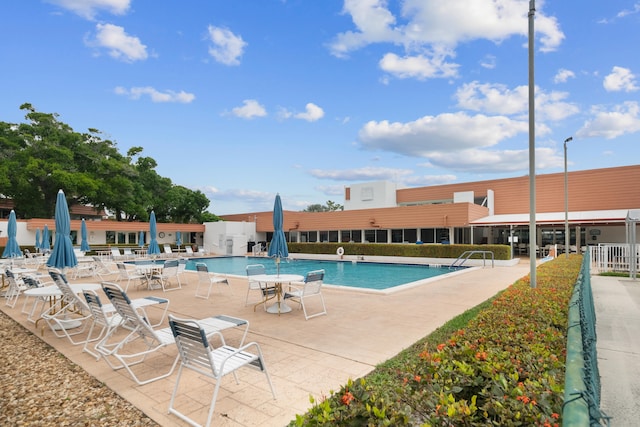 view of swimming pool with a patio