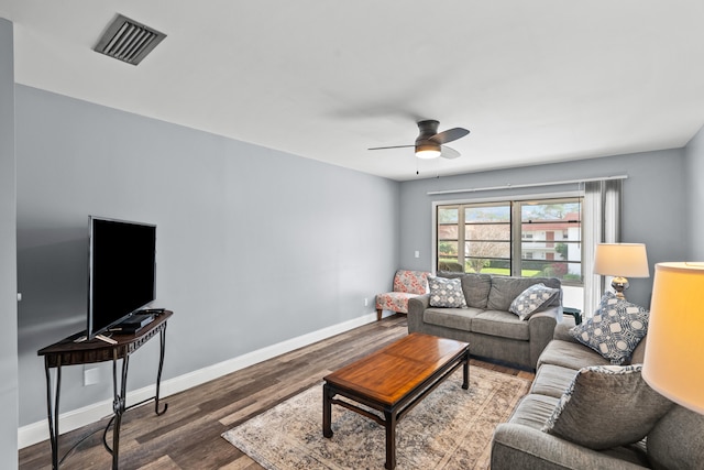 living room with hardwood / wood-style flooring and ceiling fan