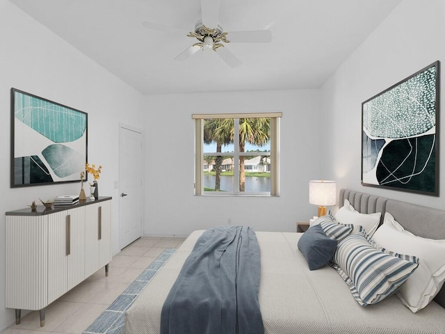 tiled bedroom with ceiling fan