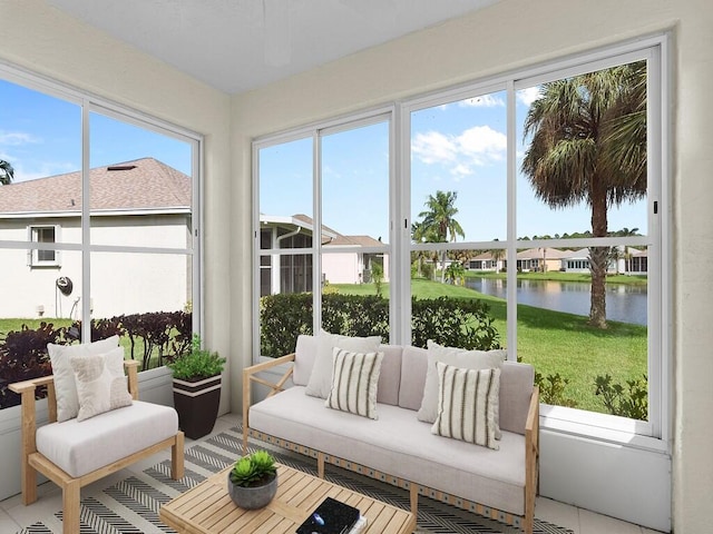 sunroom / solarium with plenty of natural light and a water view