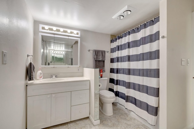 bathroom featuring walk in shower, tile patterned floors, vanity, and toilet