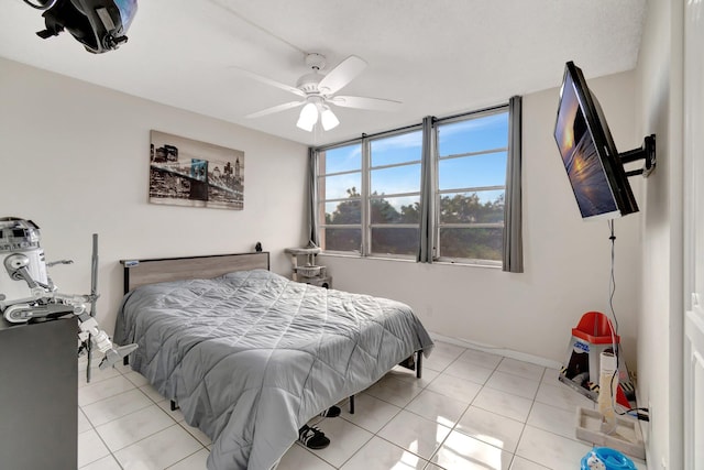 bedroom featuring ceiling fan and light tile patterned flooring