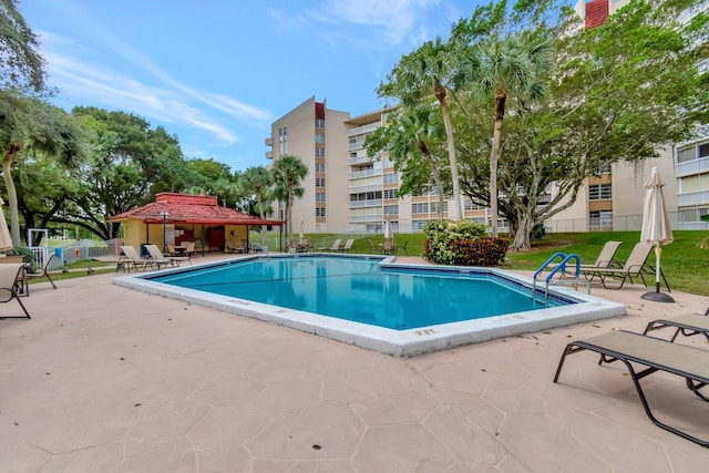 view of swimming pool with a patio