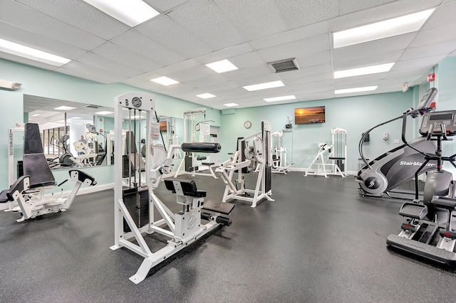 workout area with a drop ceiling