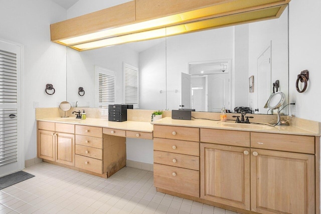 bathroom with tile patterned flooring, vanity, and vaulted ceiling