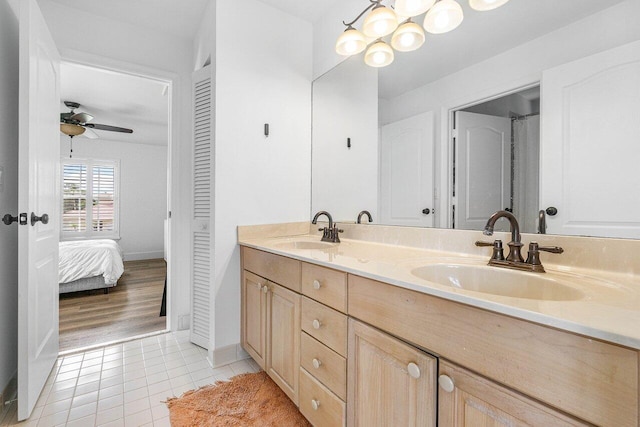 bathroom featuring vanity, ceiling fan, and tile patterned floors