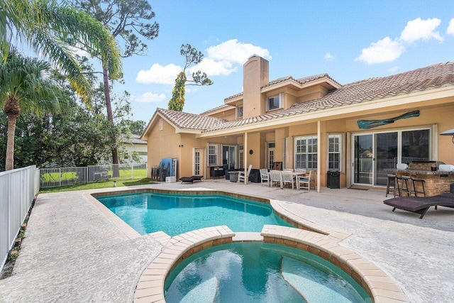 rear view of house featuring a pool with hot tub, a patio, outdoor lounge area, and ceiling fan