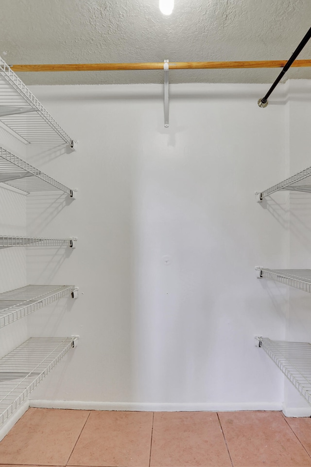 walk in closet featuring tile patterned floors