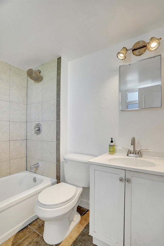 full bathroom featuring vanity, tiled shower / bath combo, and toilet