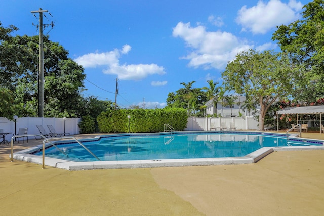 view of swimming pool featuring a patio area