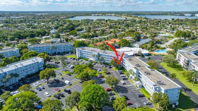 birds eye view of property featuring a water view