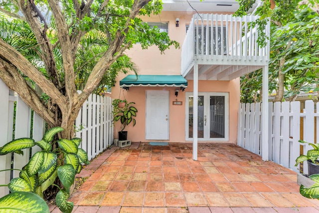 exterior space featuring french doors and a balcony