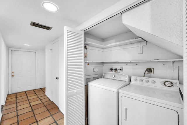 laundry room with washing machine and clothes dryer