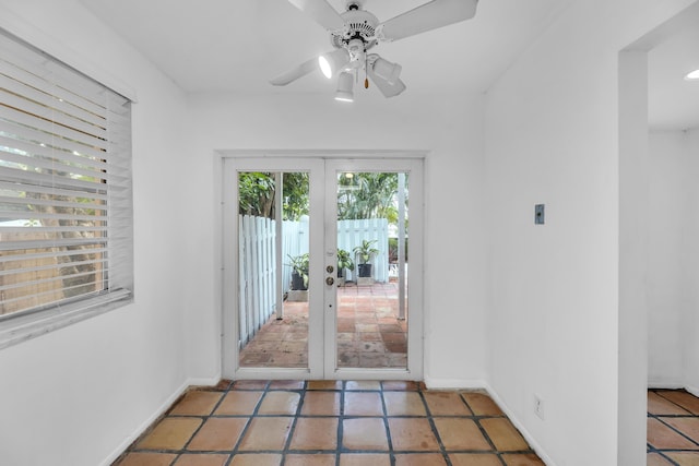 1912 NE 6th St, Deerfield Beach, FL 33441 - doorway featuring french doors, baseboards, ceiling fan, and tile patterned floors