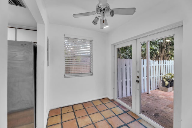 doorway featuring ceiling fan and french doors