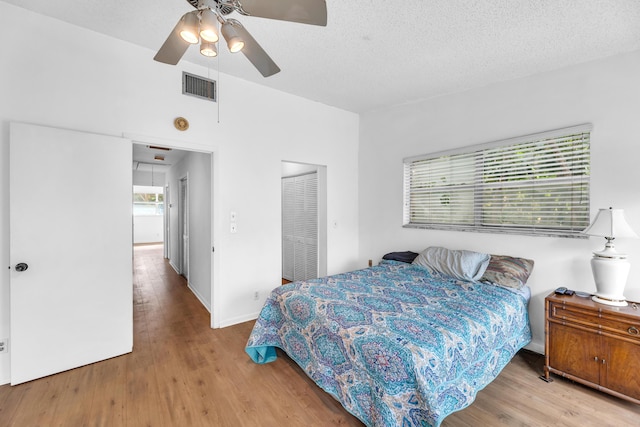 1912 NE 6th St, Deerfield Beach, FL 33441 - bedroom with wood finished floors, a closet, a textured ceiling, and a ceiling fan