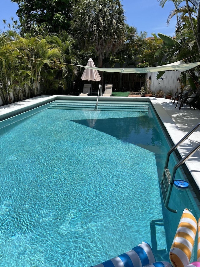 1912 NE 6th St, Deerfield Beach, FL 33441 - view of swimming pool featuring a patio area and fence