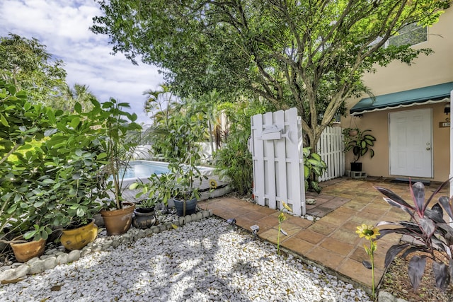 1912 NE 6th St, Deerfield Beach, FL 33441 - view of patio featuring fence and a gate