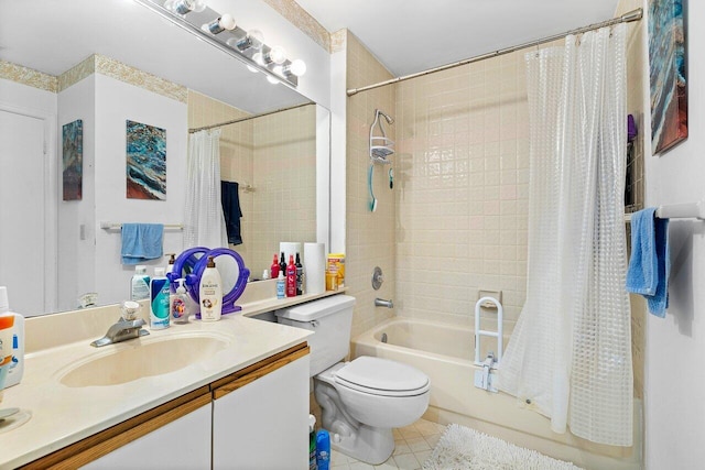 full bathroom featuring vanity, shower / bath combo with shower curtain, tile patterned floors, and toilet