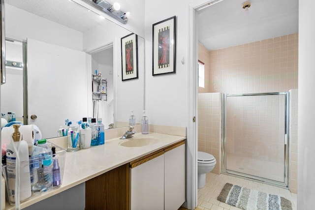 bathroom featuring tile patterned flooring, vanity, an enclosed shower, toilet, and tile walls