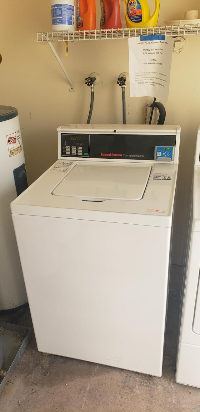 laundry room featuring water heater and washer / clothes dryer