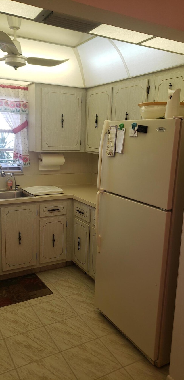 kitchen with white refrigerator and sink