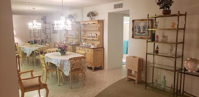 dining space with a chandelier