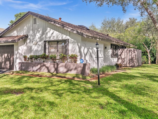 view of property exterior with a yard