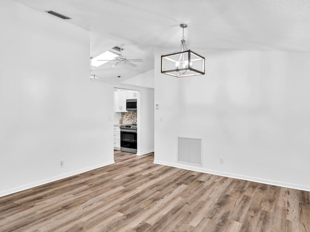 bedroom featuring hardwood / wood-style flooring, ceiling fan, and vaulted ceiling