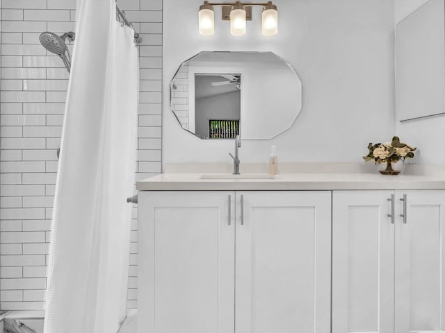 bathroom with a shower with curtain and vanity