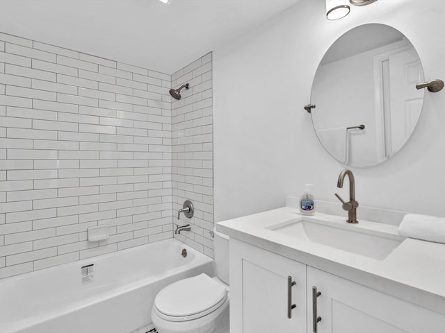 full bathroom with toilet, tiled shower / bath combo, and vanity