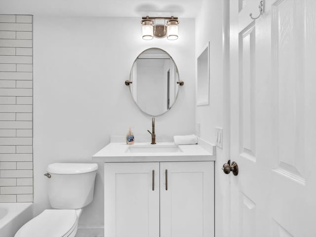 full bathroom with vanity, toilet, and tiled shower / bath combo