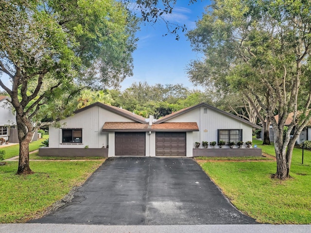 view of front facade with a front lawn and a garage