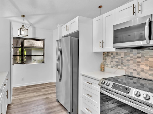 kitchen featuring stainless steel appliances, hanging light fixtures, decorative backsplash, light hardwood / wood-style floors, and white cabinets