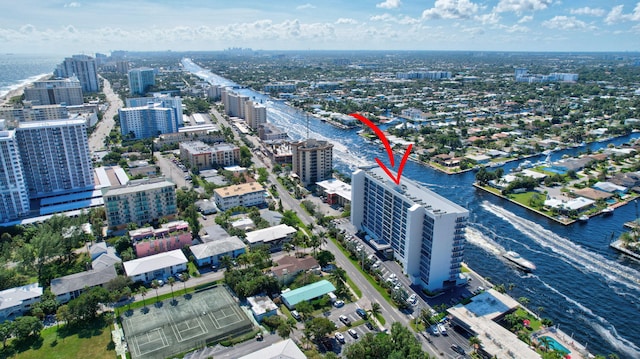 birds eye view of property with a water view