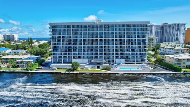 view of building exterior with a water view