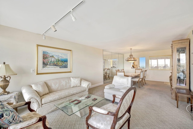 living room featuring track lighting and carpet floors