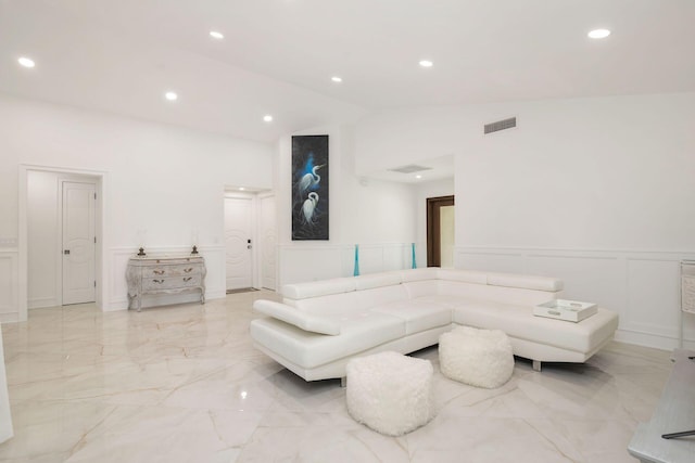 living room featuring high vaulted ceiling