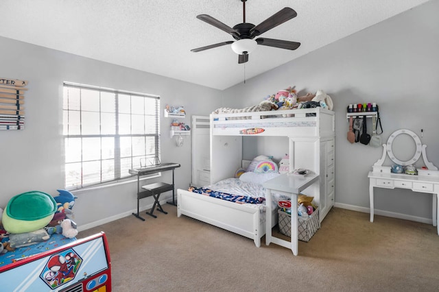 bedroom with a textured ceiling, carpet floors, and ceiling fan