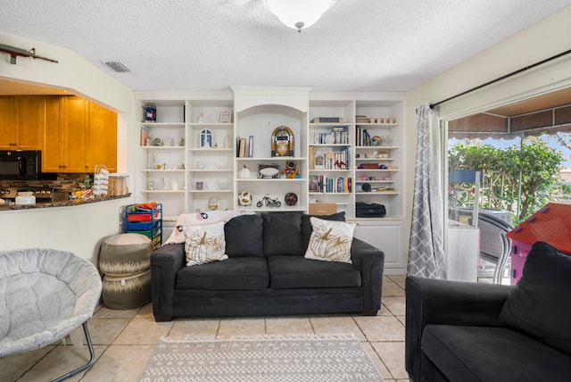 tiled living room with a textured ceiling