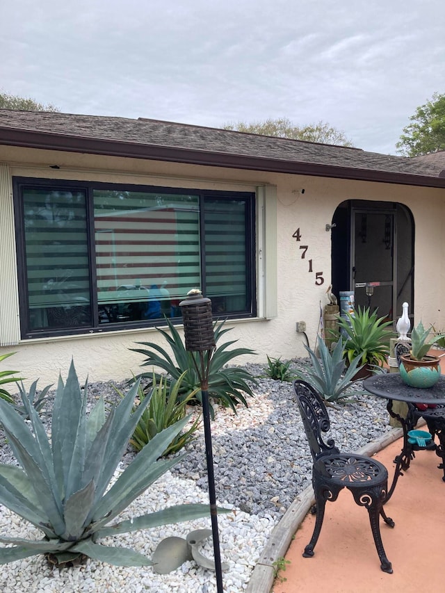 property entrance with a patio area