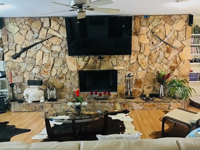 living room with hardwood / wood-style flooring and ceiling fan