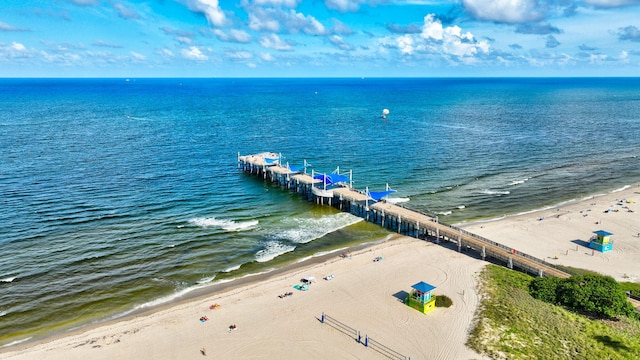 drone / aerial view featuring a view of the beach and a water view