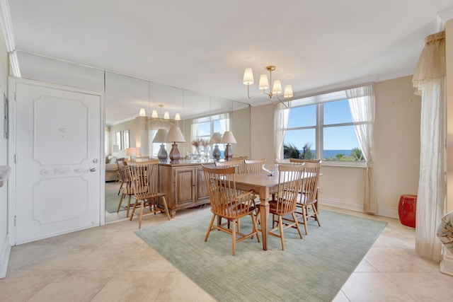 dining space featuring a notable chandelier and light tile patterned flooring