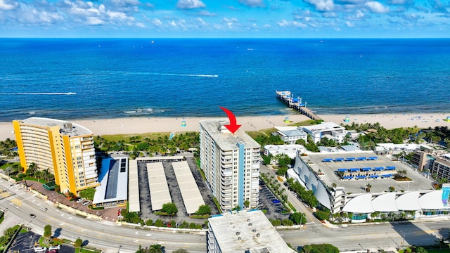 aerial view with a beach view and a water view